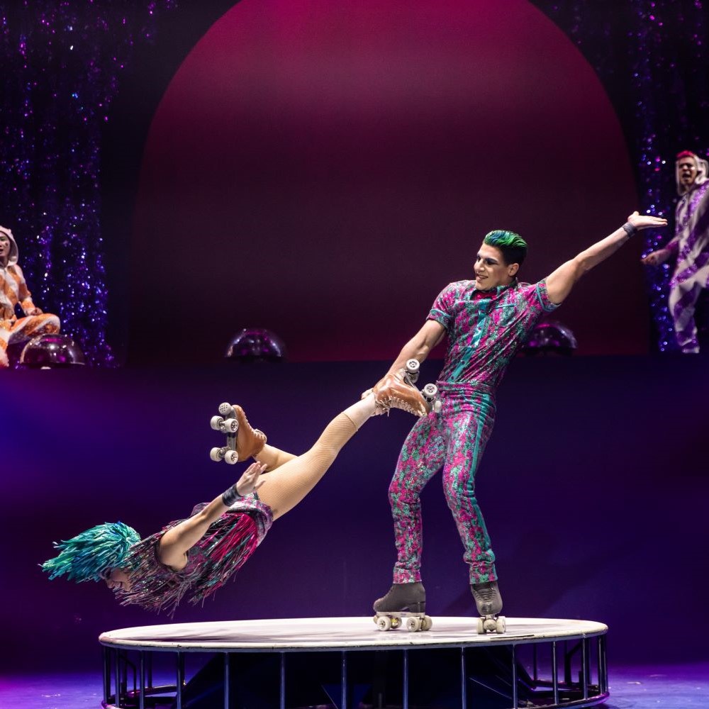 Man spinning woman while wearing roller skates - Theater at MSG Cirque du Soleil